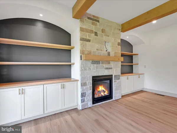 a living room with a fireplace furniture and a fireplace