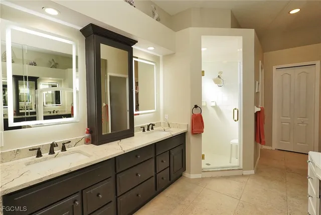 a spacious bathroom with a double vanity sink mirror and double