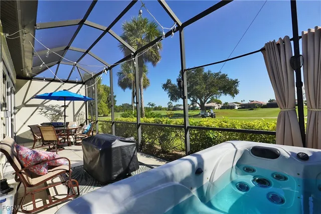 a view of balcony with furniture and garden