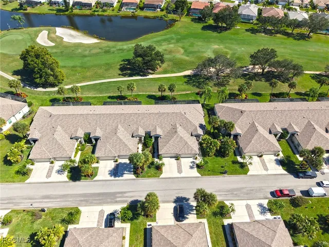 an aerial view of a house with a garden and swimming pool