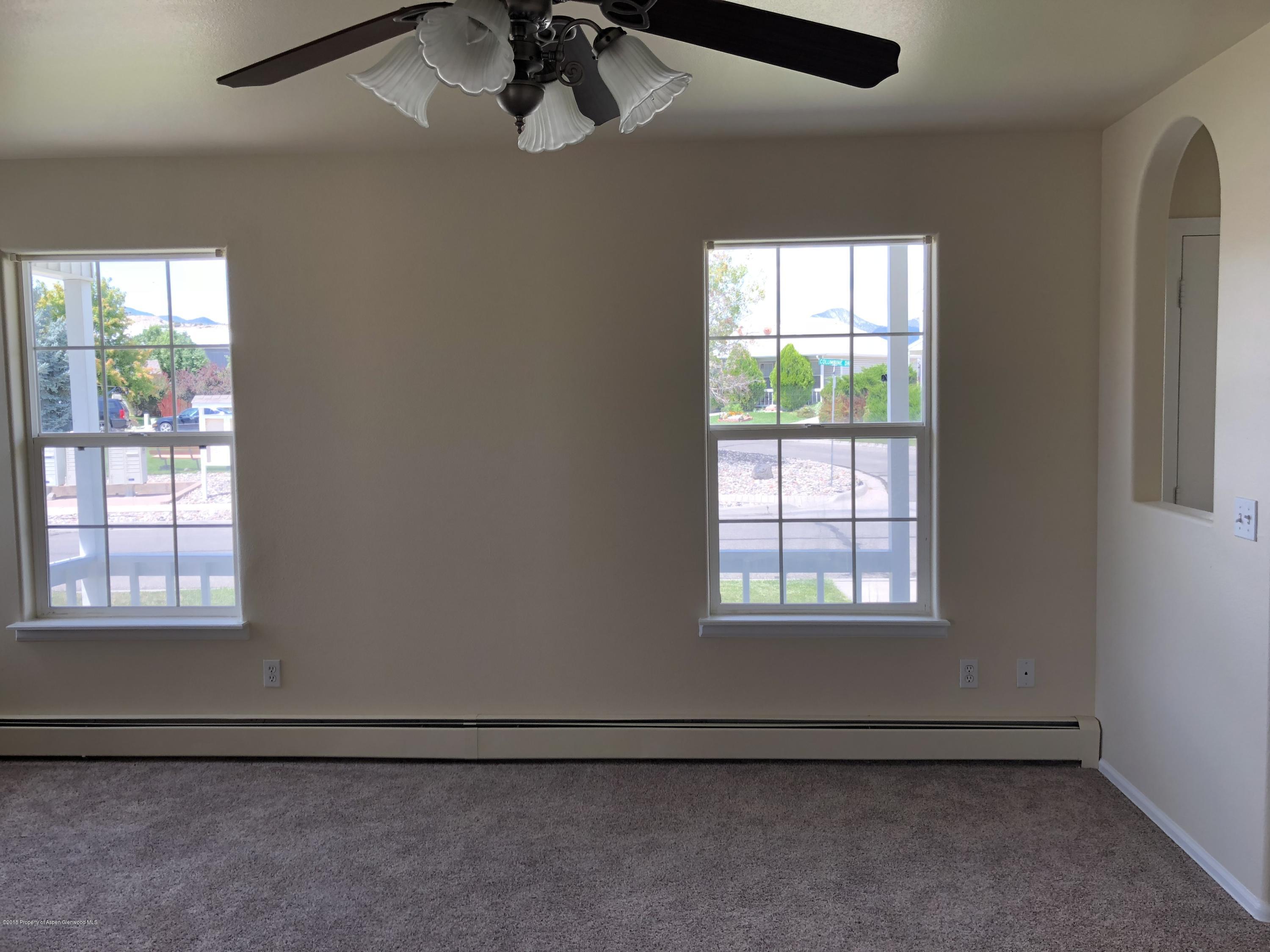 403 Columbine Drive Rifle, CO 81650 - Photo 5 of 17 an empty room with windows