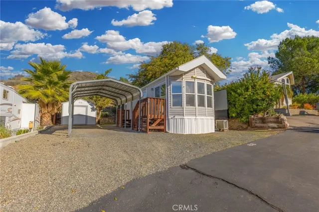 a view of a house with a cars park