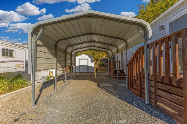 an aerial view of residential house with outdoor space and parking