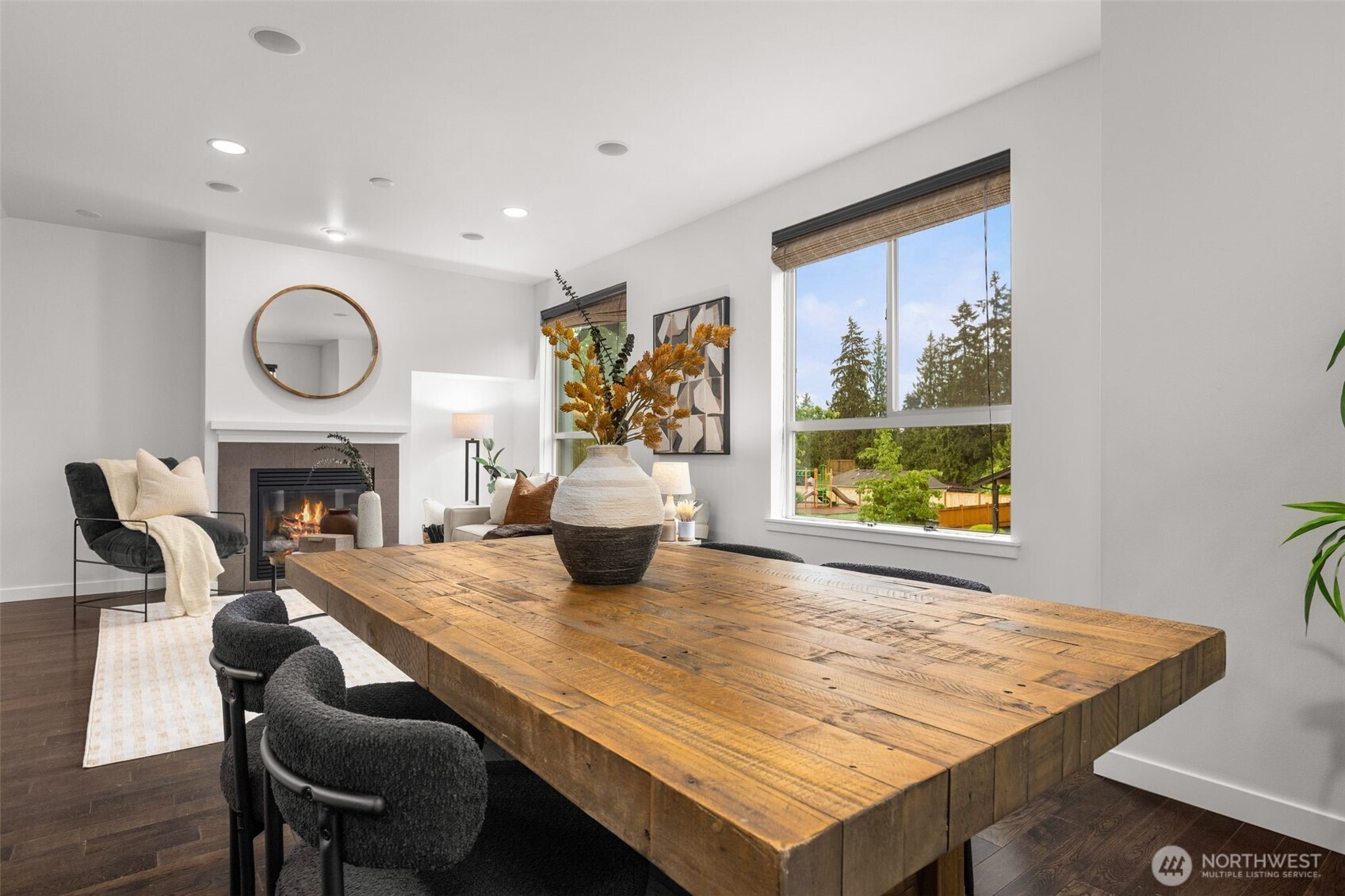 16516 2nd Park Southeast Bothell, WA 98012 - Photo 9 of 39 a living room with furniture a fireplace and a large window