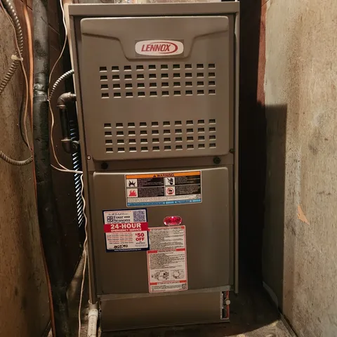 a view of a yard with wooden fence