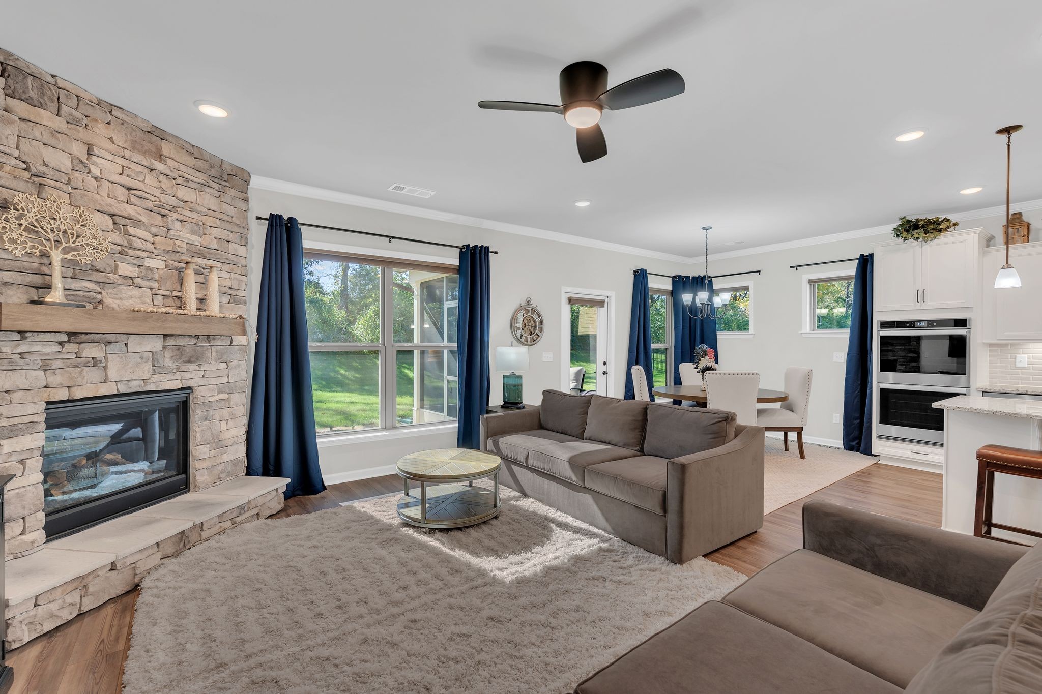 2061 Hardin Place Spring Hill, TN 37174 - Photo 15 of 65 a living room with furniture and a fireplace