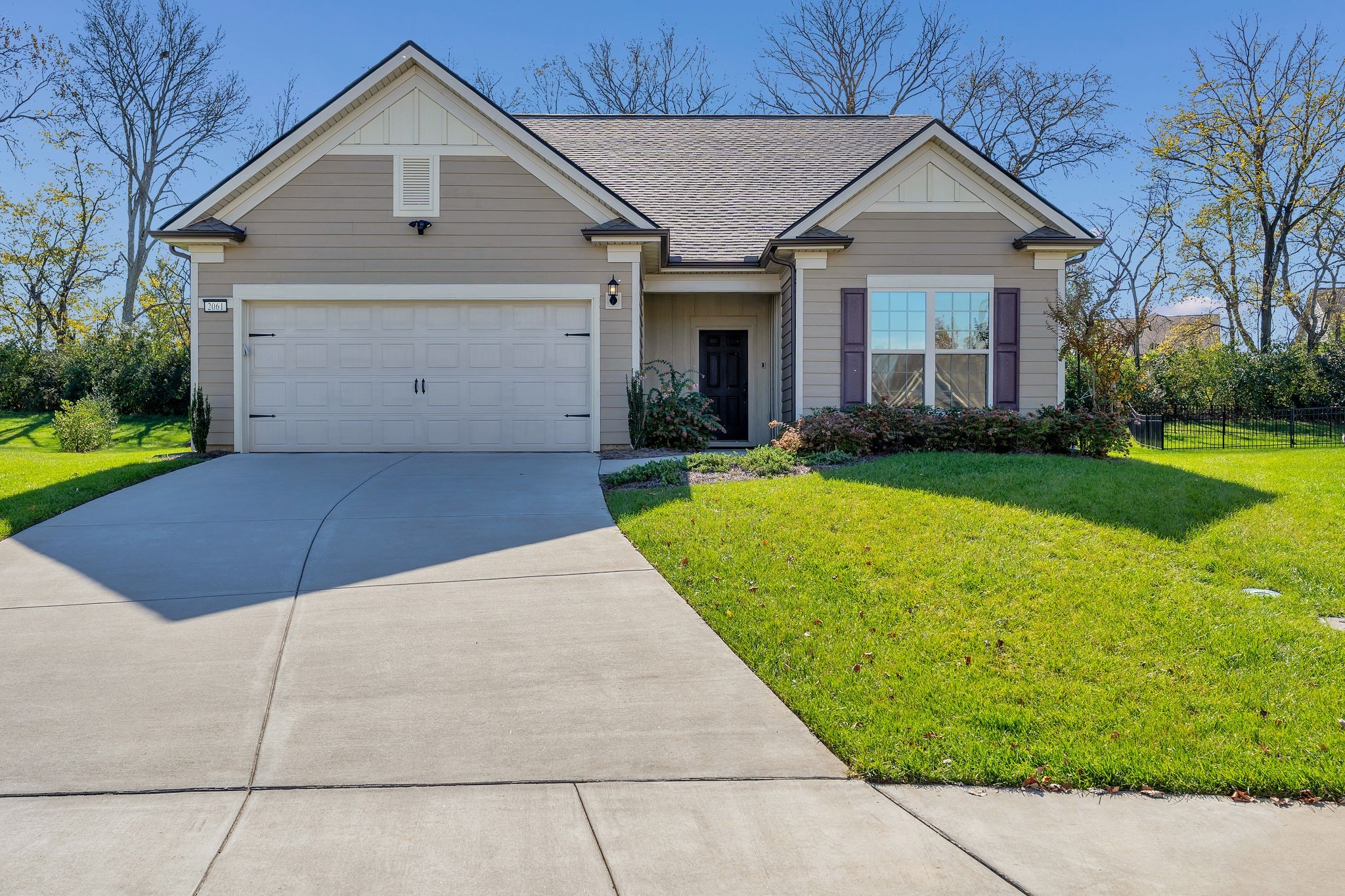 2061 Hardin Place Spring Hill, TN 37174 - Photo 2 of 65 a front view of a house with a yard and garage