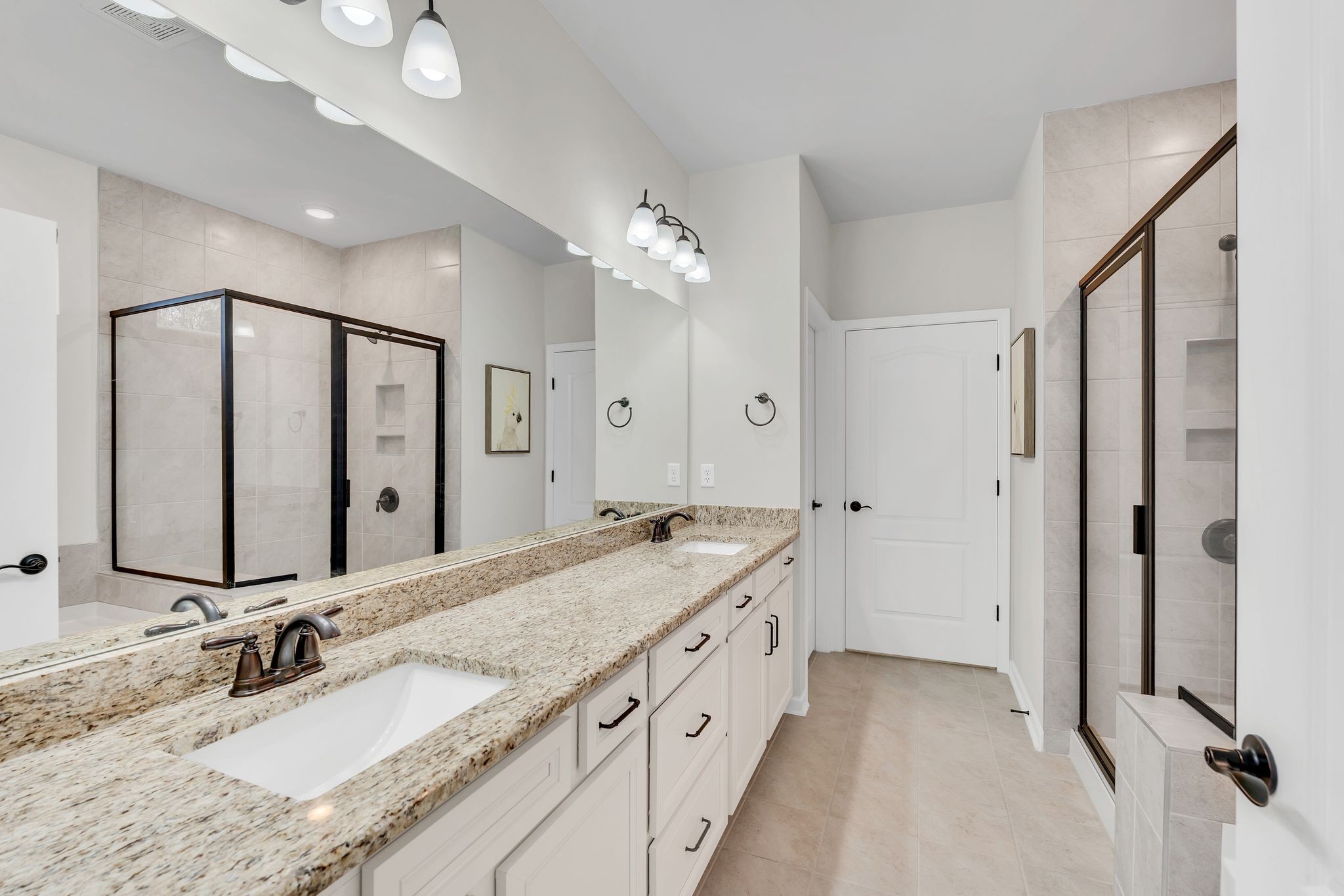 2061 Hardin Place Spring Hill, TN 37174 - Photo 21 of 65 a bathroom with a granite countertop double vanity sink and mirror