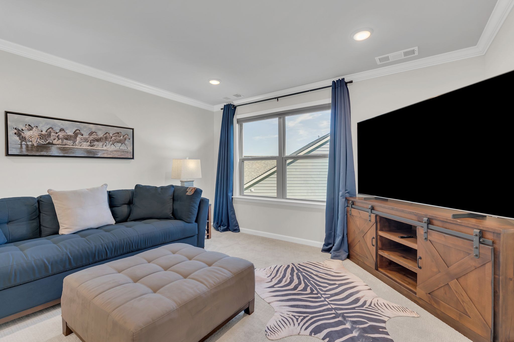 2061 Hardin Place Spring Hill, TN 37174 - Photo 26 of 65 a living room with furniture and a flat screen tv