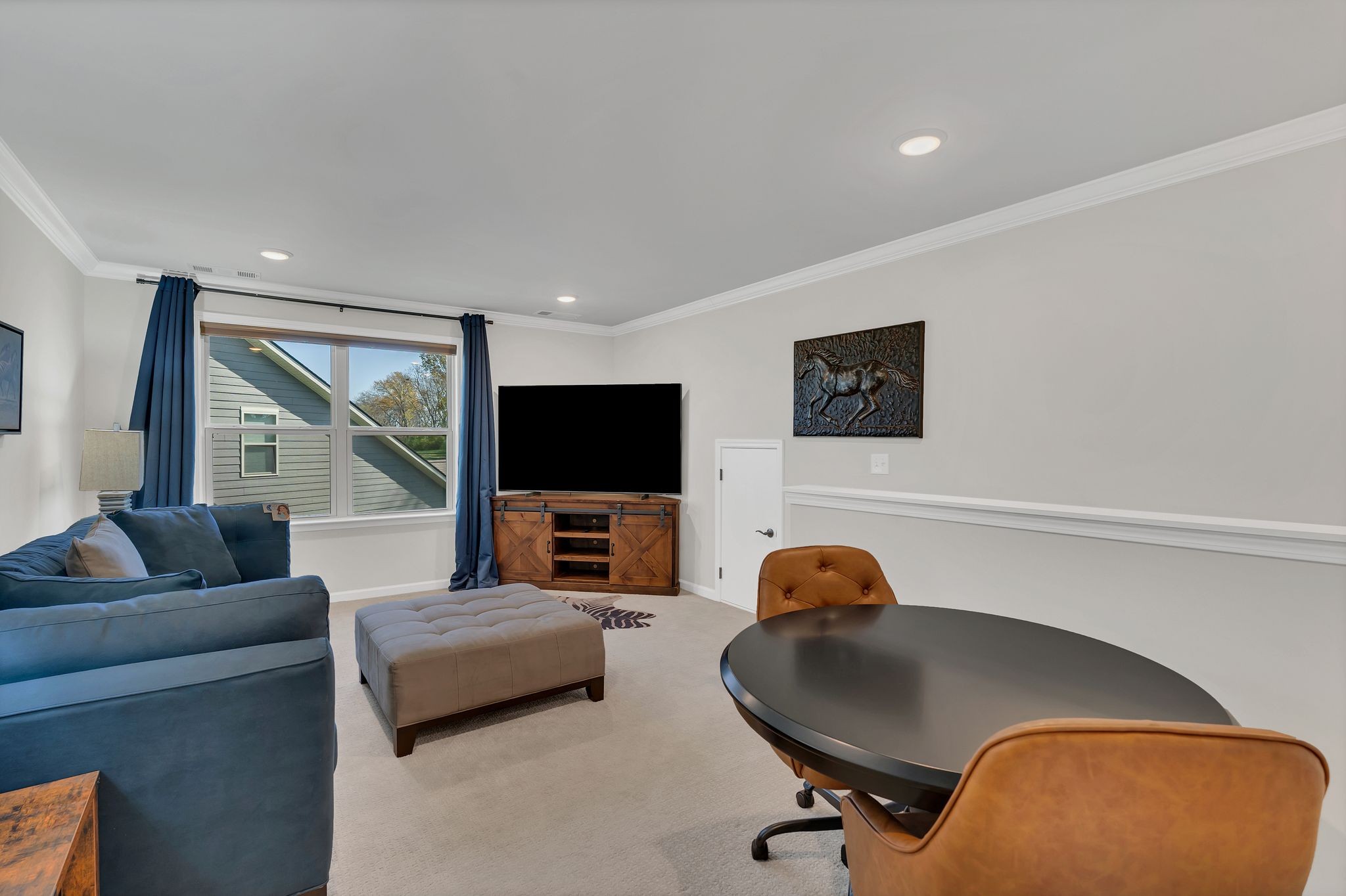 2061 Hardin Place Spring Hill, TN 37174 - Photo 28 of 65 a living room with furniture and a flat screen tv