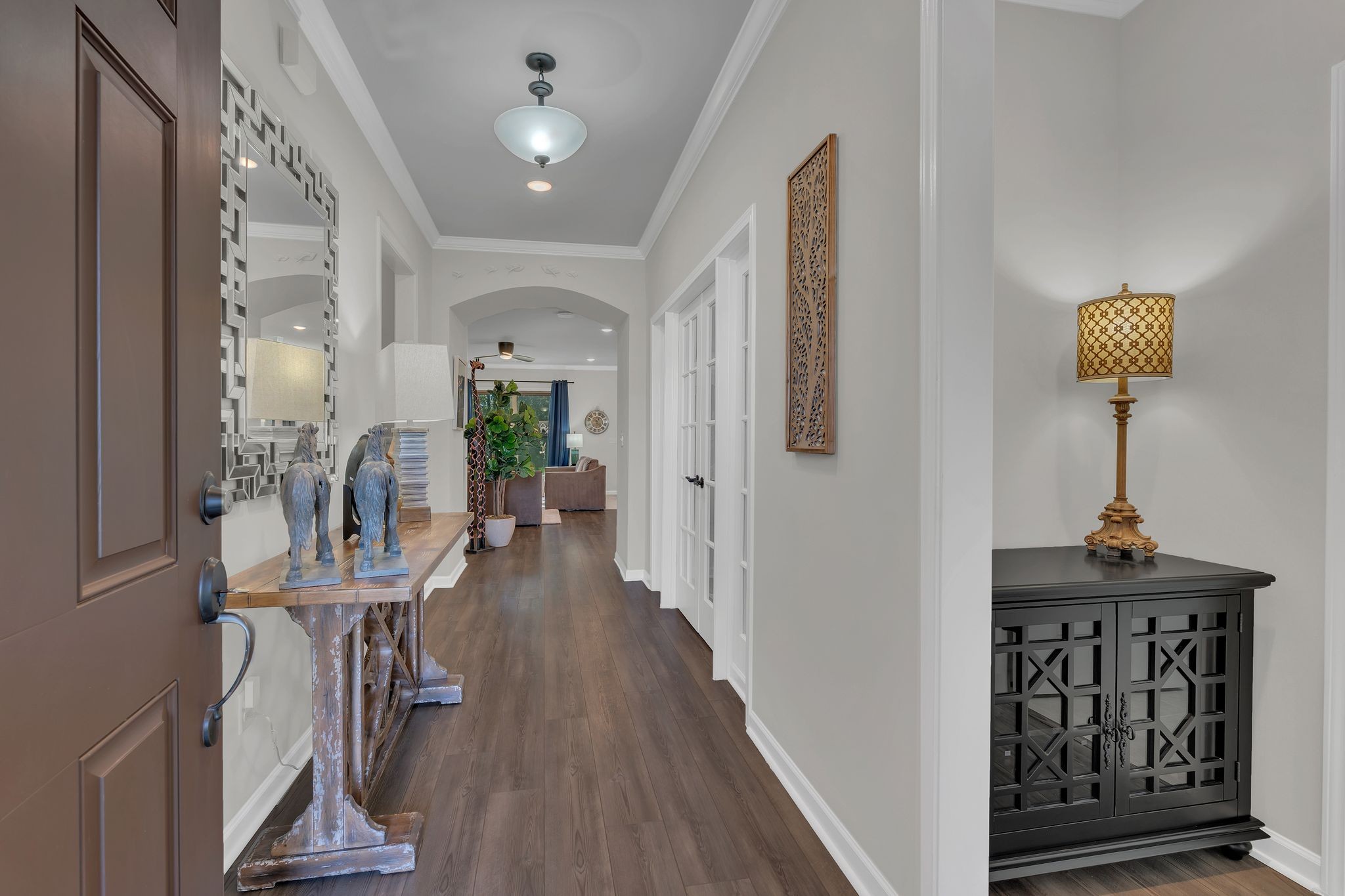 2061 Hardin Place Spring Hill, TN 37174 - Photo 5 of 65 a view of a hallway with wooden floor and stairs