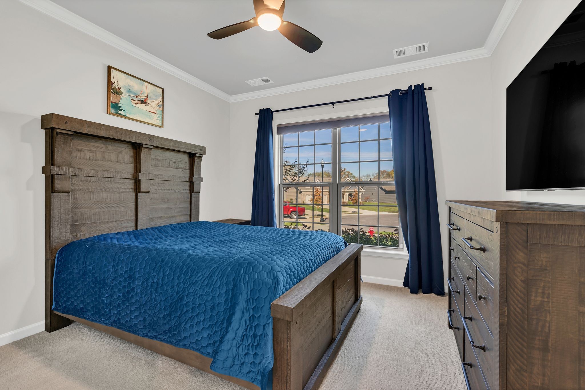 2061 Hardin Place Spring Hill, TN 37174 - Photo 6 of 65 a bedroom with a bed and a flat screen tv