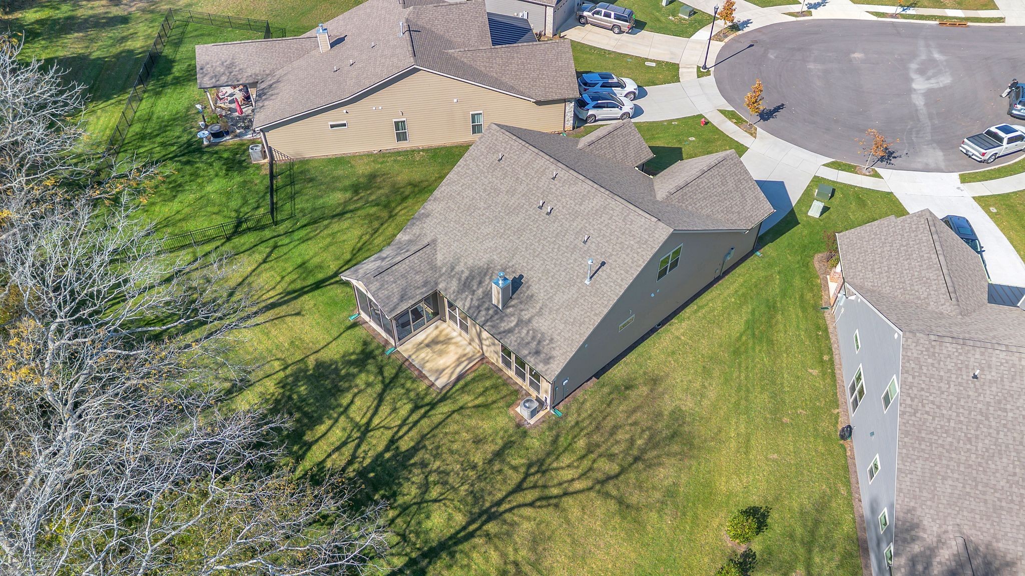 2061 Hardin Place Spring Hill, TN 37174 - Photo 62 of 65 an aerial view of a house with a yard and trees