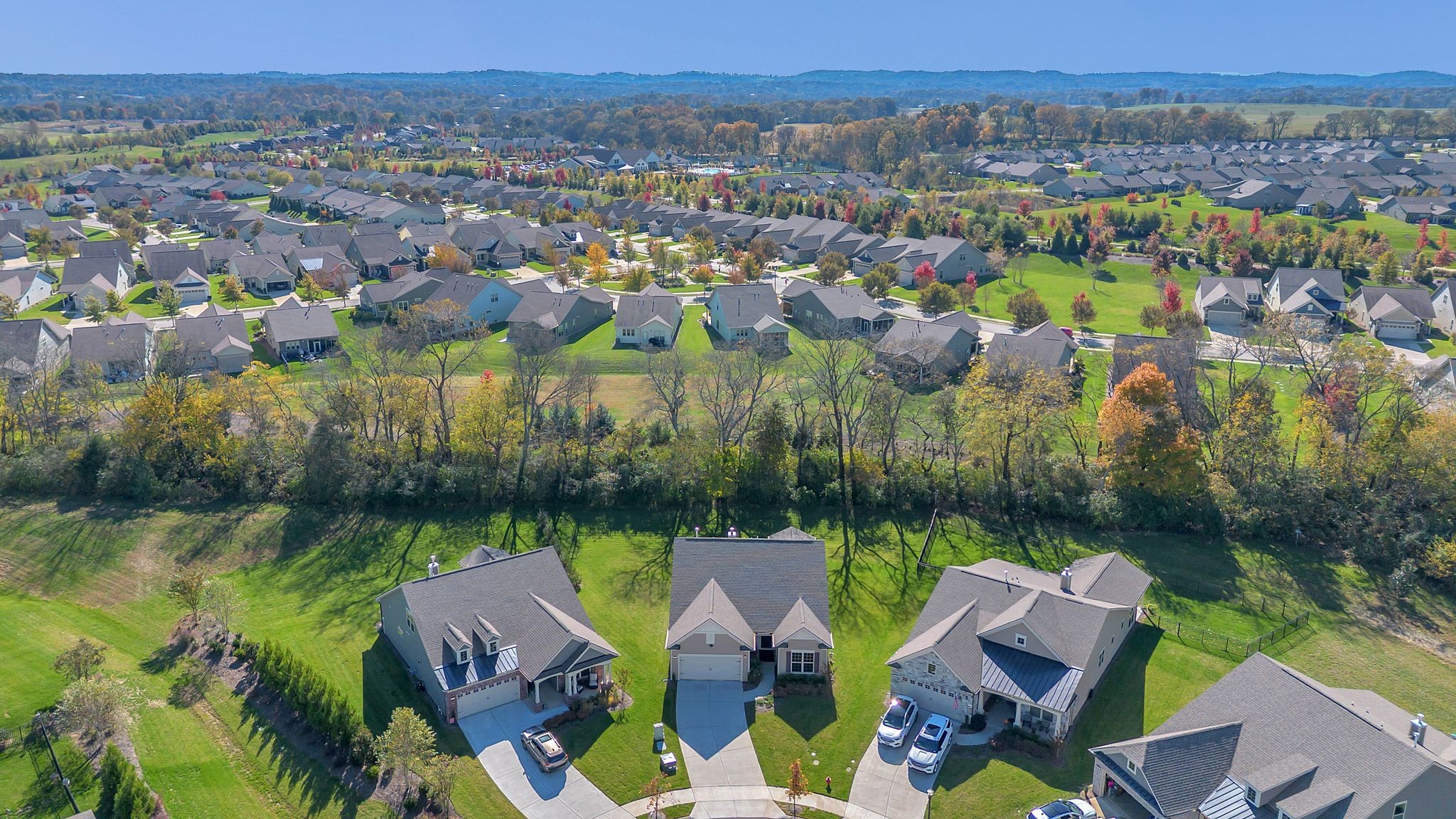2061 Hardin Place Spring Hill, TN 37174 - Photo 63 of 65 an aerial view of residential houses with outdoor space and lake view