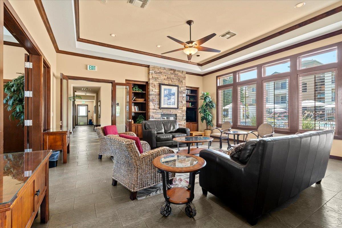 1360 Shady Lane, Unit 1022 Turlock, CA 95382 - Photo 11 of 16 a living room with furniture and a large window