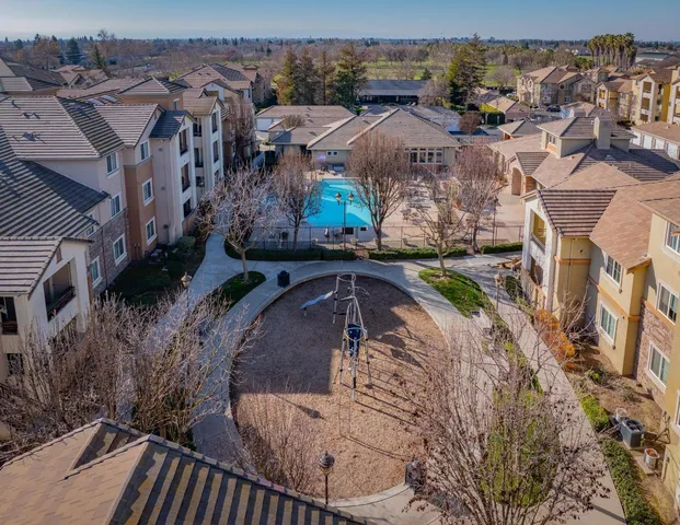 a view of multiple houses with a yard