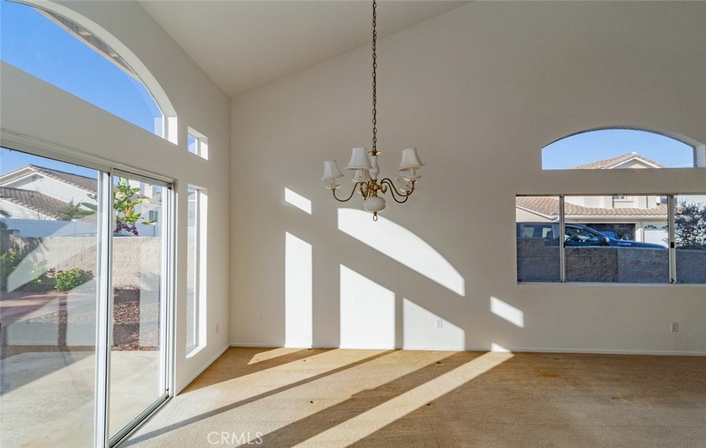 2038 Ridgeline Avenue Vista, CA 92081 - Photo 5 of 32 a view of a livingroom with furniture staircase and a large window