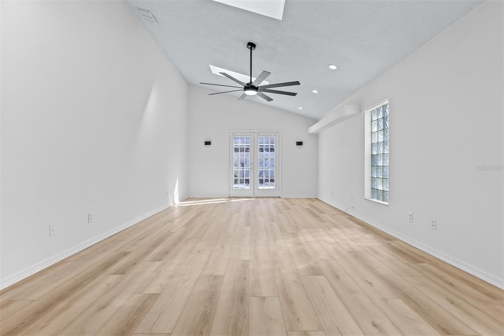 1734 Powder Ridge Drive Valrico, FL 33594 - Photo 12 of 32 wooden floor in an empty room with a window