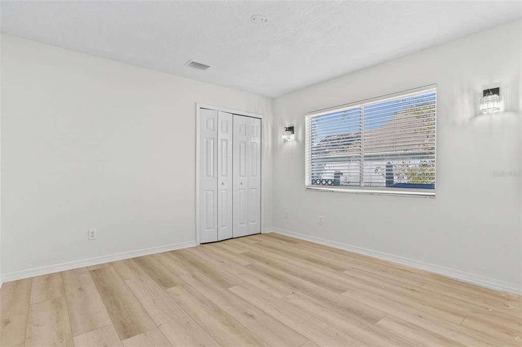 1734 Powder Ridge Drive Valrico, FL 33594 - Photo 23 of 32 a view of empty room with wooden floor