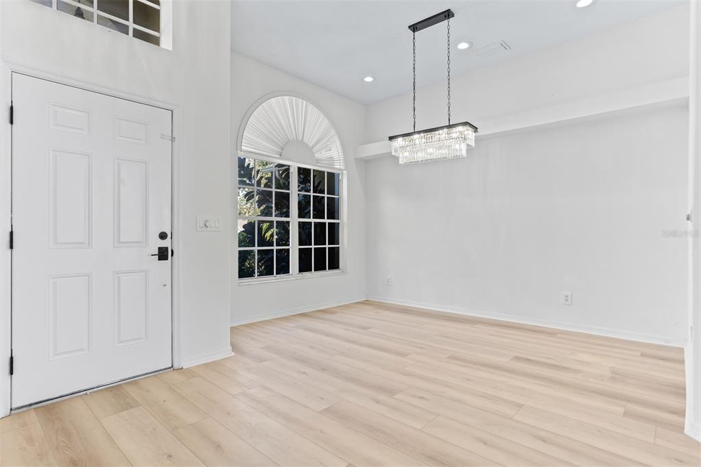 1734 Powder Ridge Drive Valrico, FL 33594 - Photo 3 of 32 a view of a room with a large window and chandelier fan