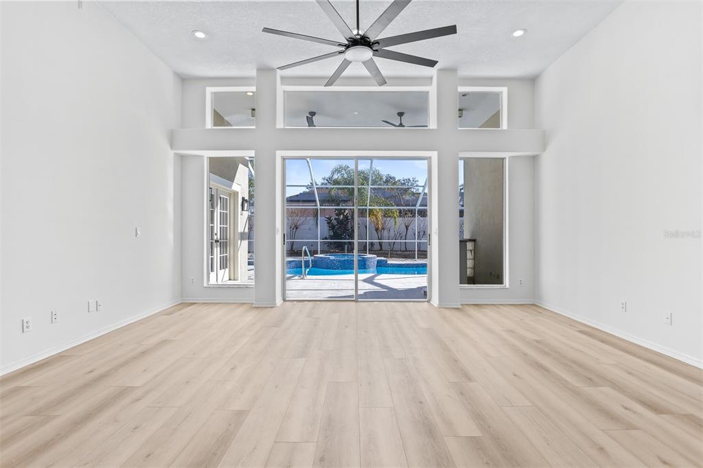 1734 Powder Ridge Drive Valrico, FL 33594 - Photo 10 of 32 an empty room with windows and fan