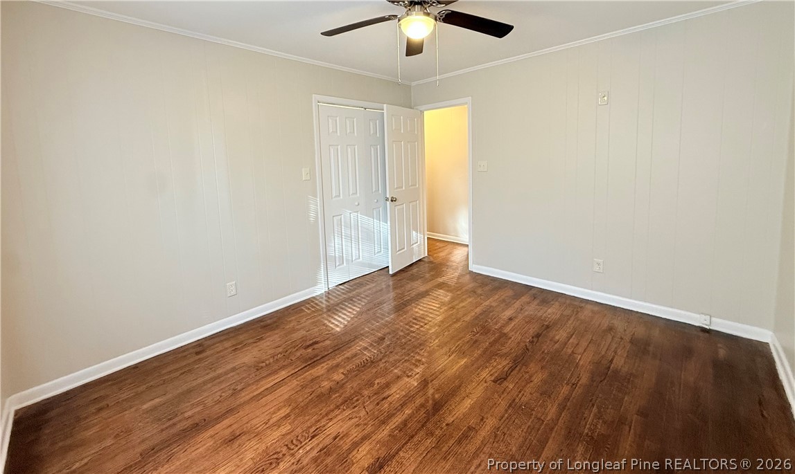 425 North Platte Road Fayetteville, NC 28303 - Photo 13 of 30 an empty room with wooden floor and windows