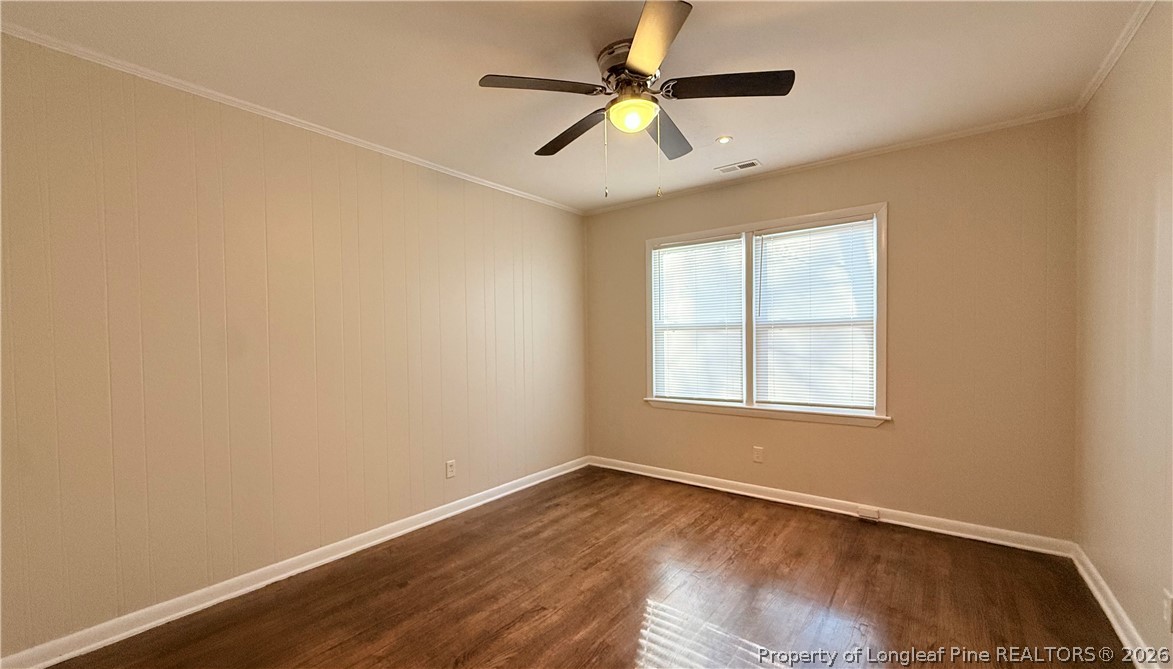 425 North Platte Road Fayetteville, NC 28303 - Photo 14 of 30 an empty room with wooden floor fan and windows