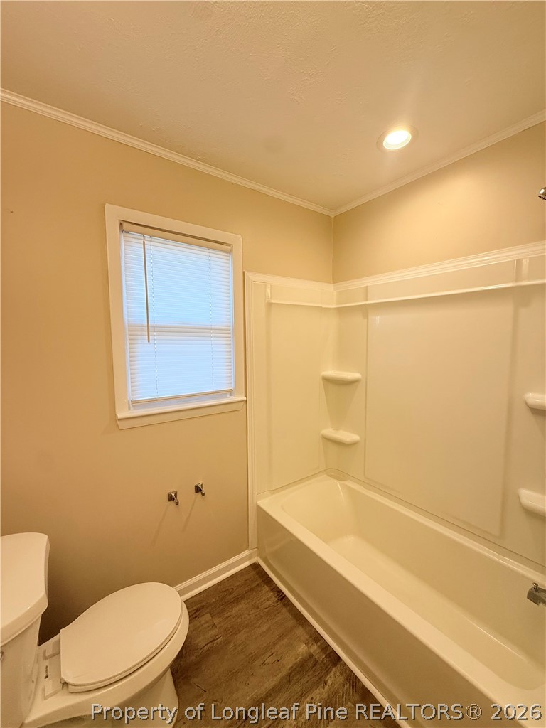425 North Platte Road Fayetteville, NC 28303 - Photo 16 of 30 a bathroom with a toilet and shower