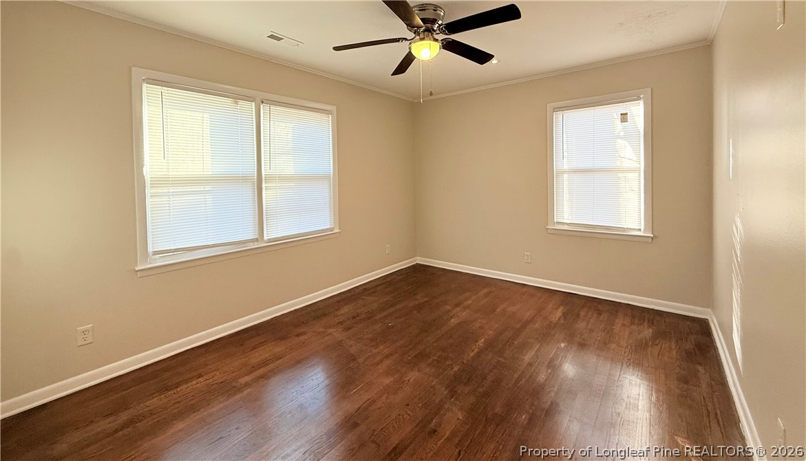 425 North Platte Road Fayetteville, NC 28303 - Photo 17 of 30 a view of an empty room with wooden floor and a window