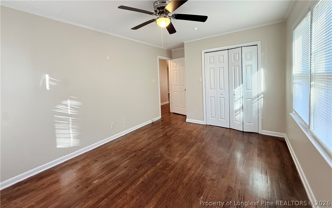 425 North Platte Road Fayetteville, NC 28303 - Photo 19 of 30 an empty room with wooden floor fan and windows