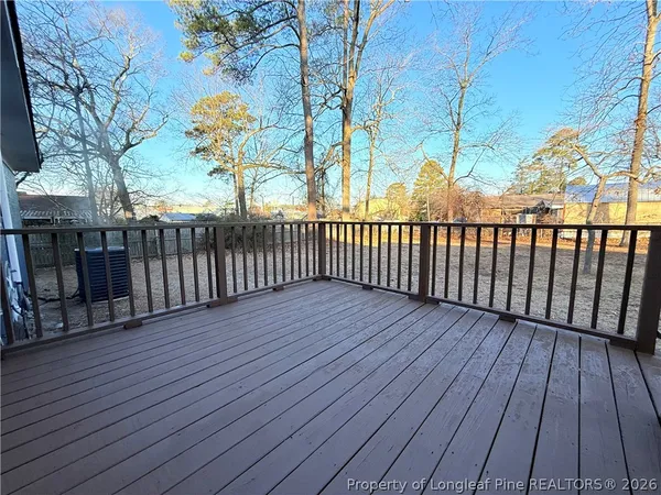 a view of deck with wooden floor and fence