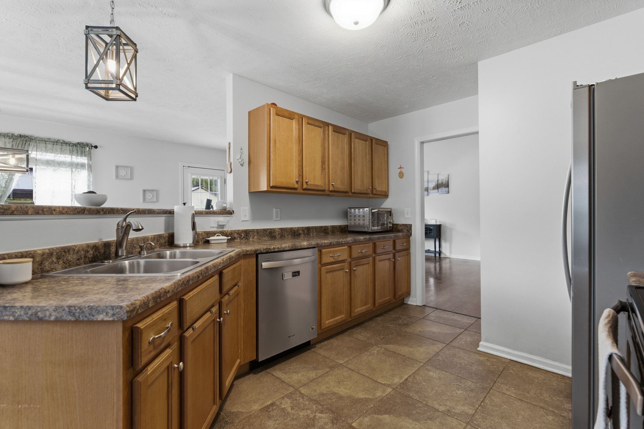 2045 Barretts Ridge Drive Murfreesboro, TN 37130 - Photo 13 of 33 a kitchen with stainless steel appliances granite countertop a sink stove and refrigerator