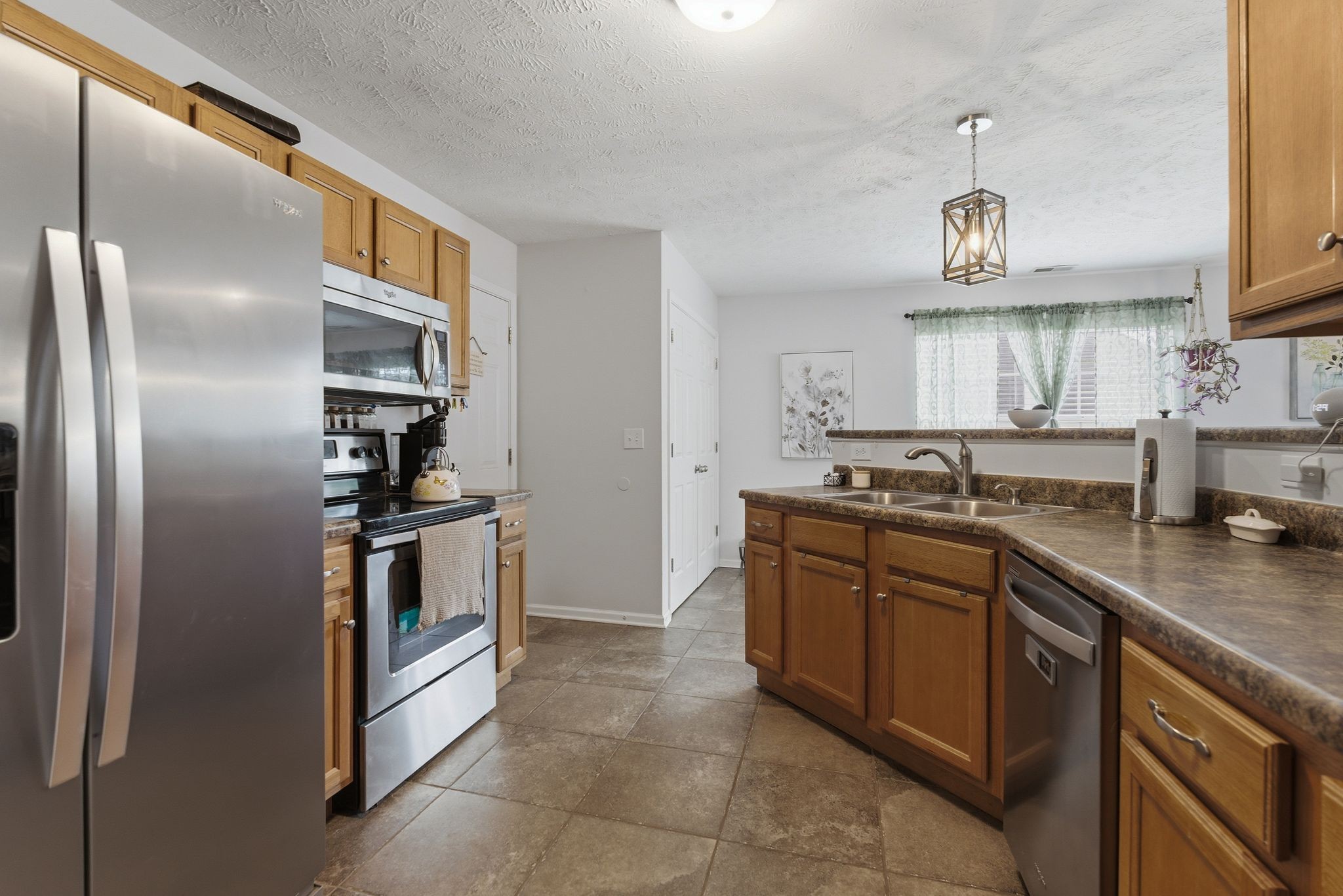 2045 Barretts Ridge Drive Murfreesboro, TN 37130 - Photo 14 of 33 a kitchen with granite countertop a sink and stainless steel appliances