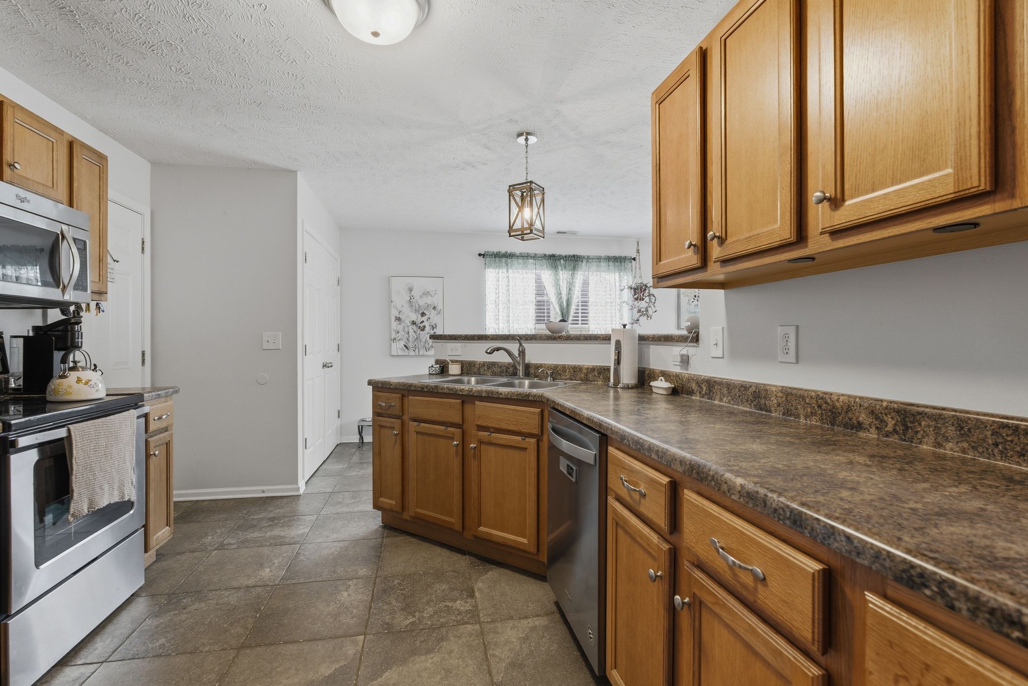 2045 Barretts Ridge Drive Murfreesboro, TN 37130 - Photo 15 of 33 a kitchen with stainless steel appliances granite countertop a sink stove and cabinets