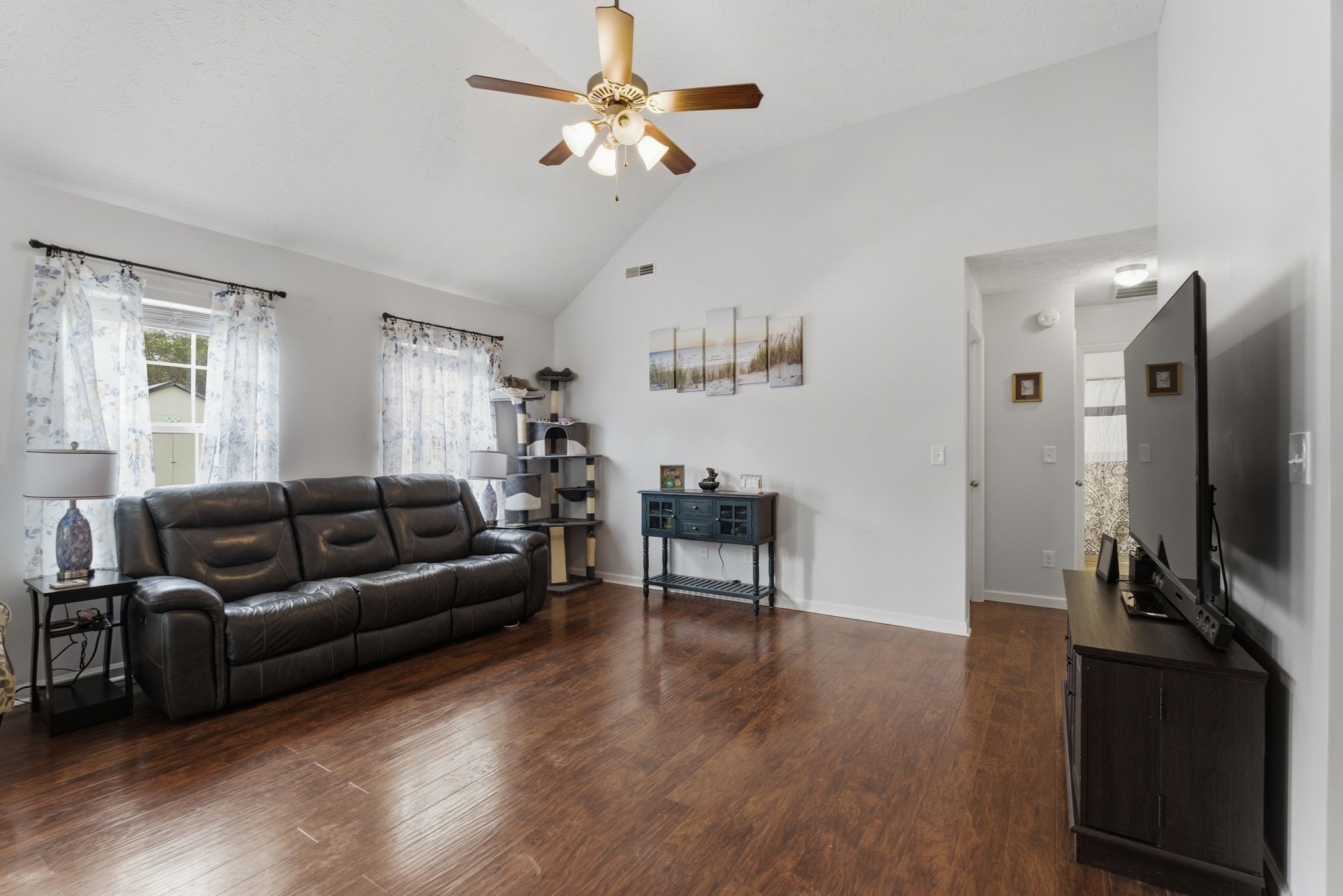 2045 Barretts Ridge Drive Murfreesboro, TN 37130 - Photo 3 of 33 a living room with furniture flat screen tv and wooden floor