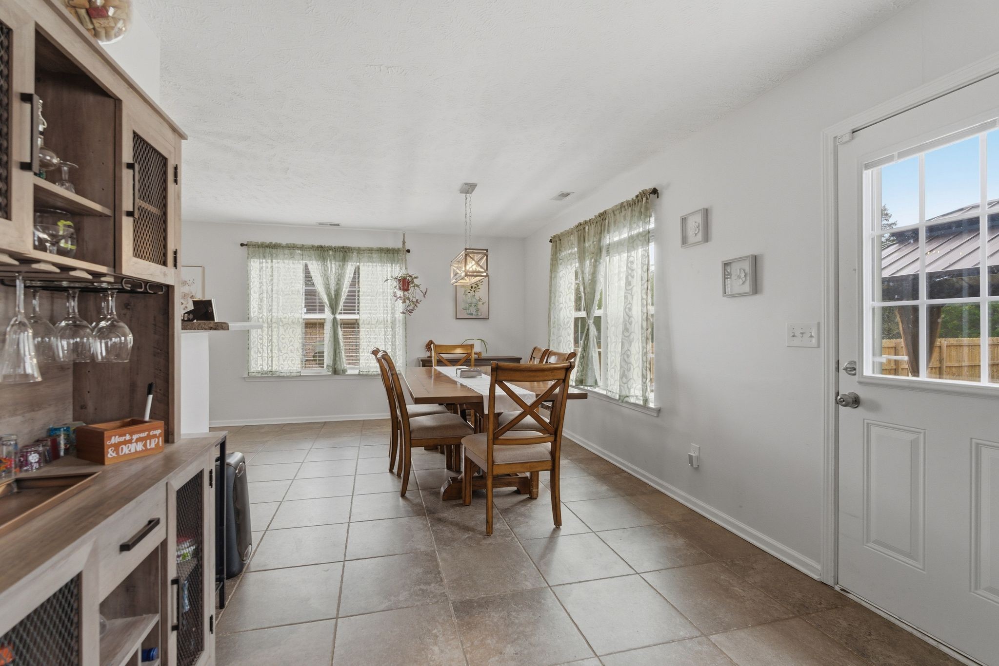 2045 Barretts Ridge Drive Murfreesboro, TN 37130 - Photo 7 of 33 a view of a dining room with furniture and a window