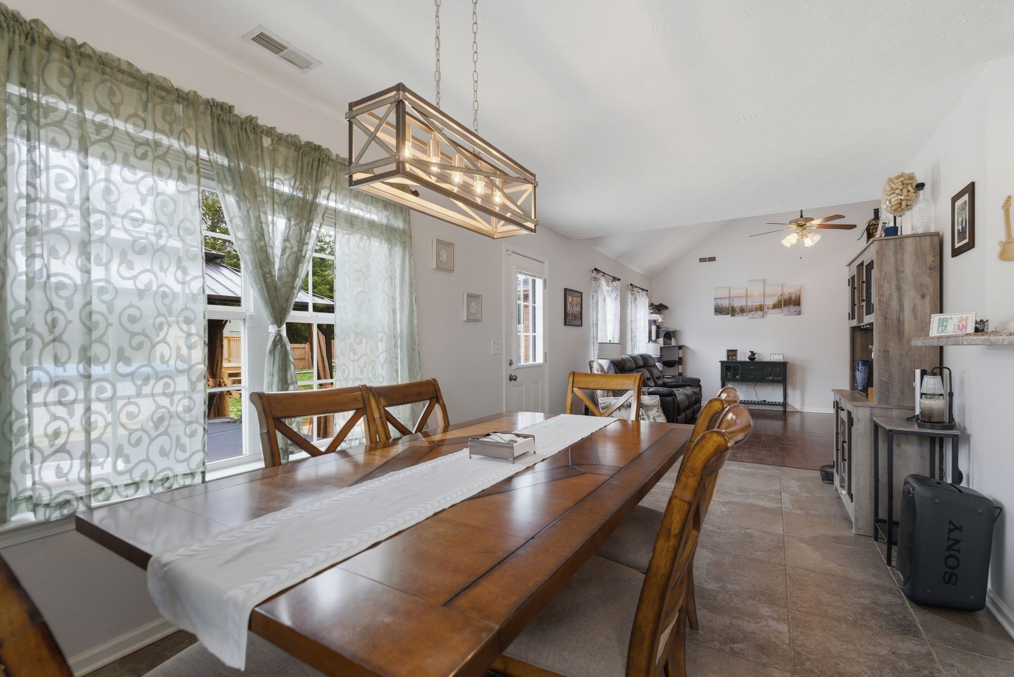 2045 Barretts Ridge Drive Murfreesboro, TN 37130 - Photo 10 of 33 a view of a dining area with furniture and a chandelier