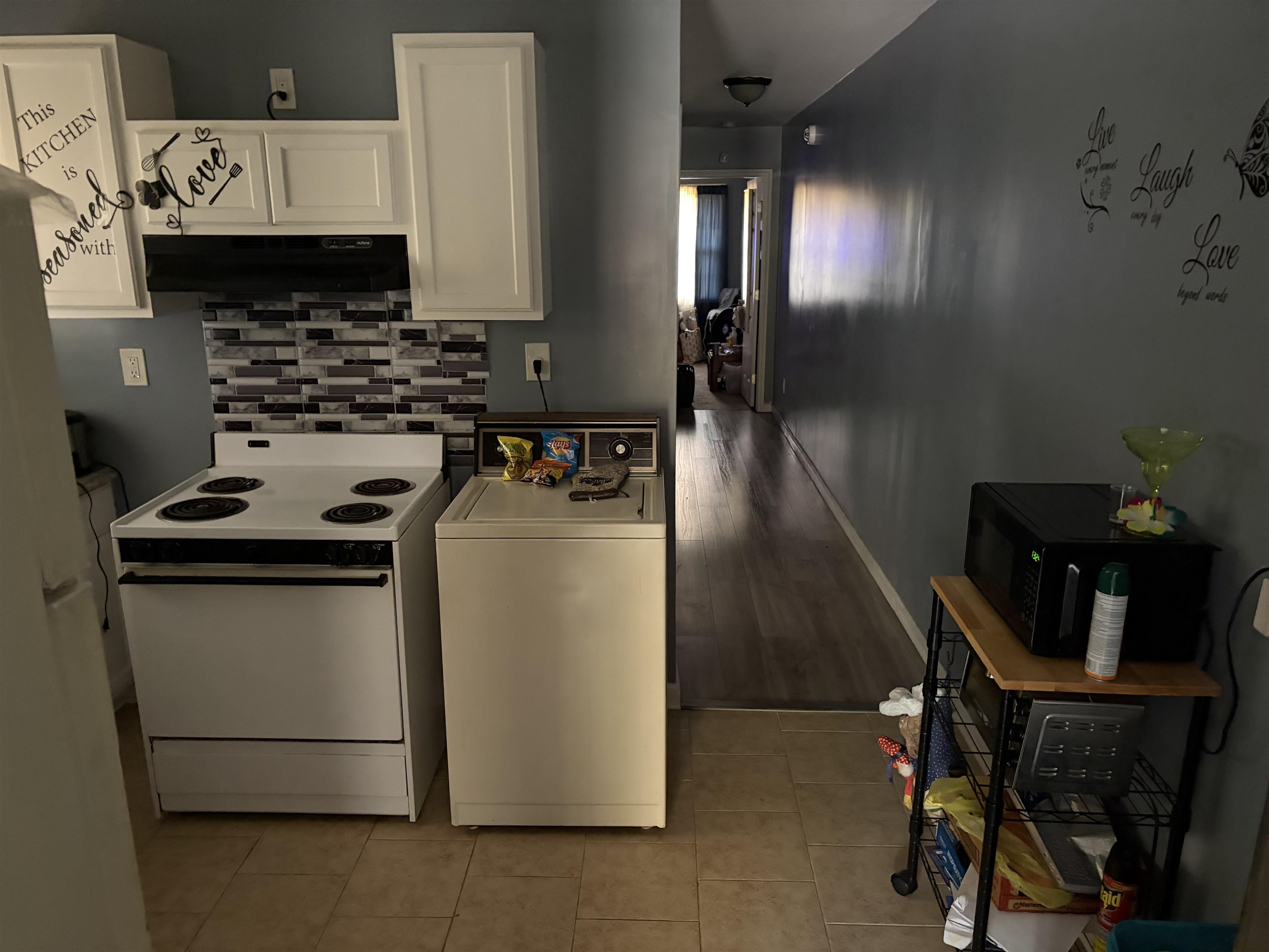 1278 Edith Avenue Memphis, TN 38106 - Photo 11 of 17 a kitchen with a refrigerator a stove a sink and a stove