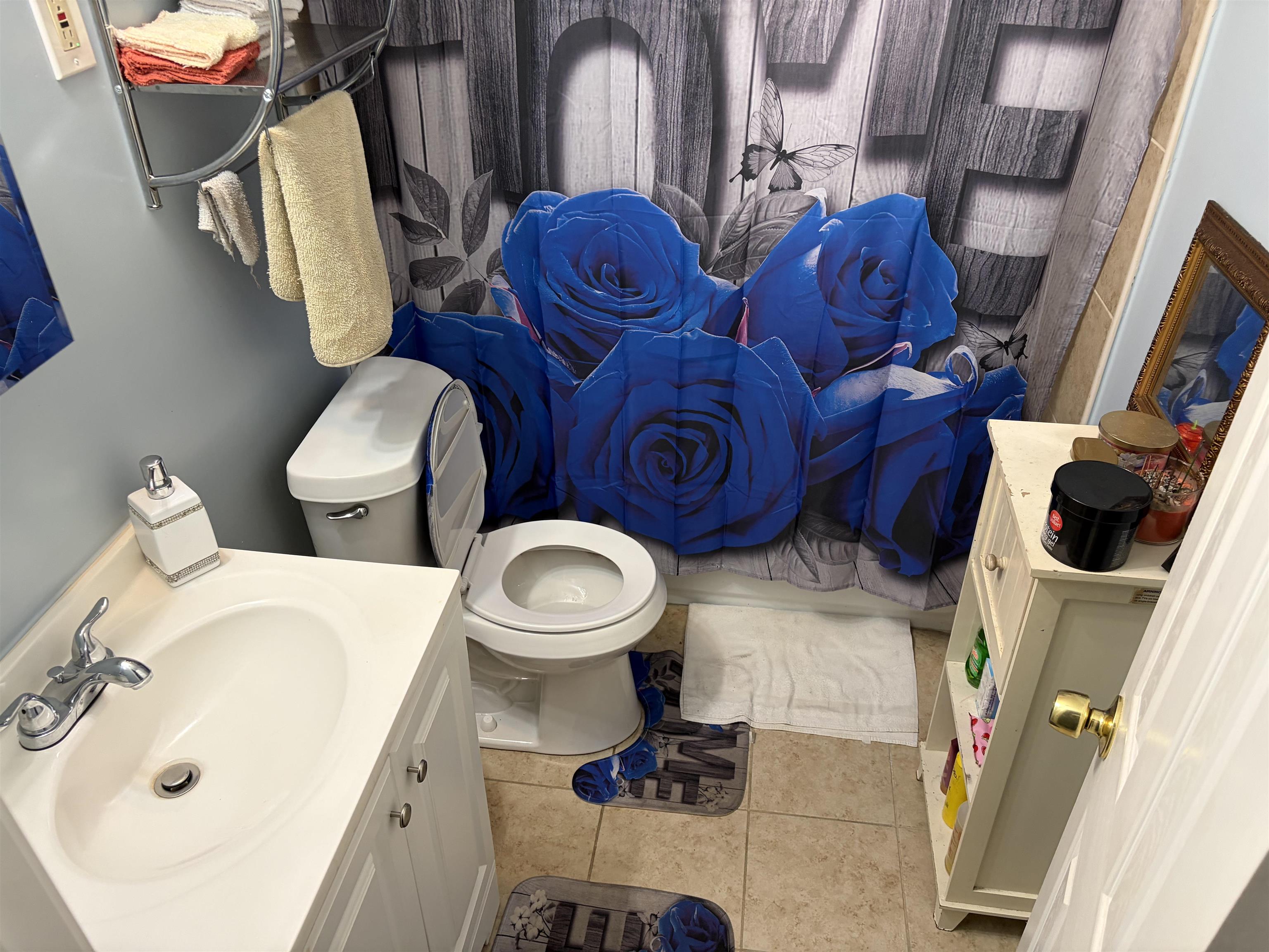 1278 Edith Avenue Memphis, TN 38106 - Photo 15 of 17 a bathroom with a toilet mirror and sink