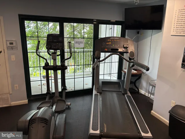 a view of gym equipment with windows