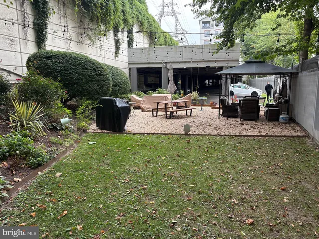 a view of a backyard with sitting area