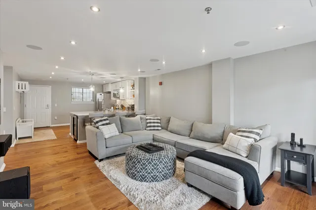 a living room with furniture and a table