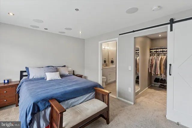 a bedroom with a bed and a table