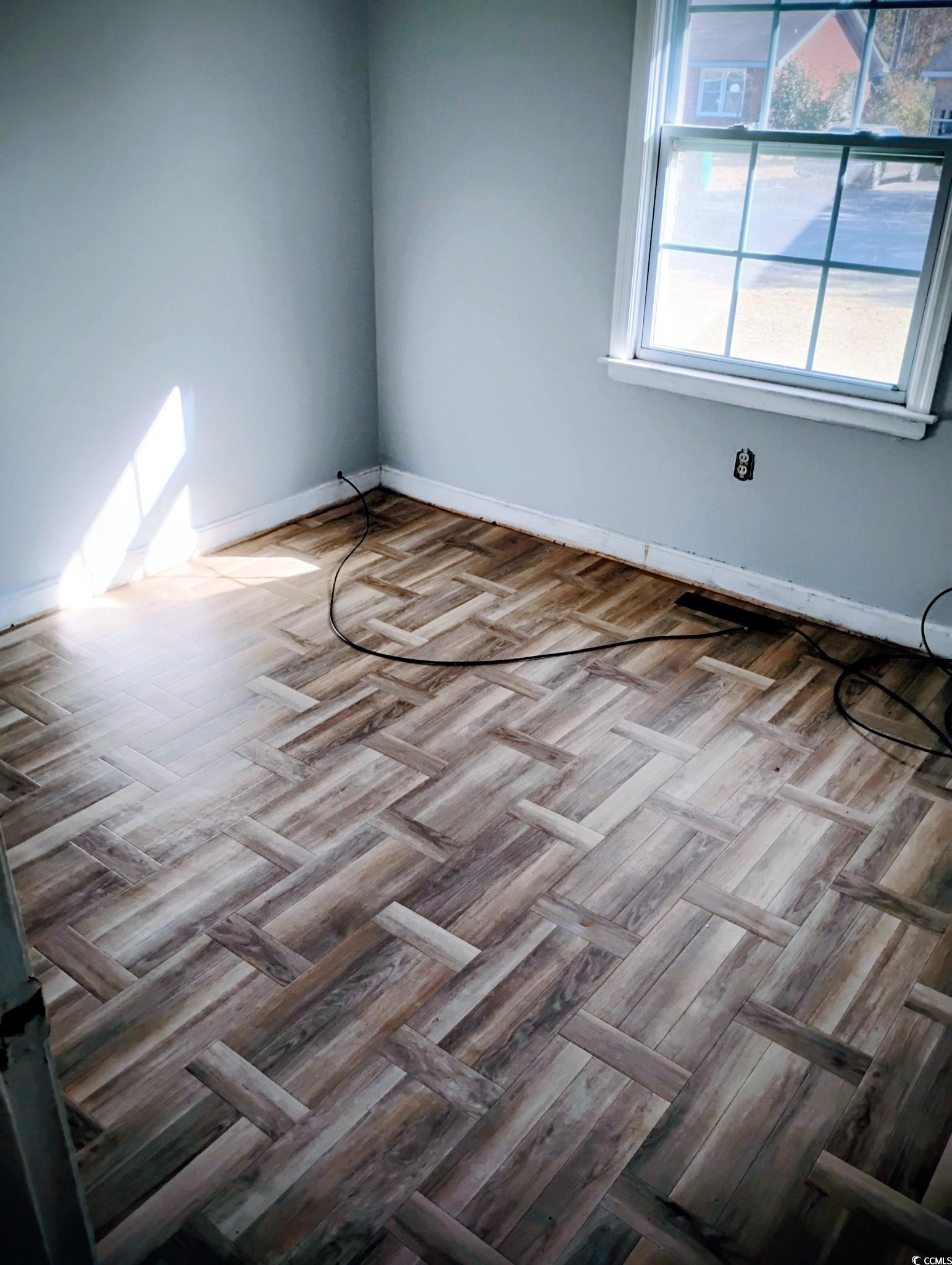 54 Juniper Place Georgetown, SC 29440 - Photo 6 of 11 Unfurnished room featuring baseboards