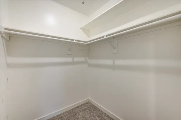a view of an empty walk in closet