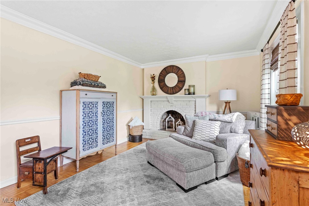 22250 Mastick Road Cleveland, OH 44126 - Photo 6 of 40 Living area featuring ornamental molding and a fireplace