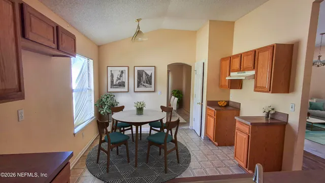 a view of a dining room with furniture