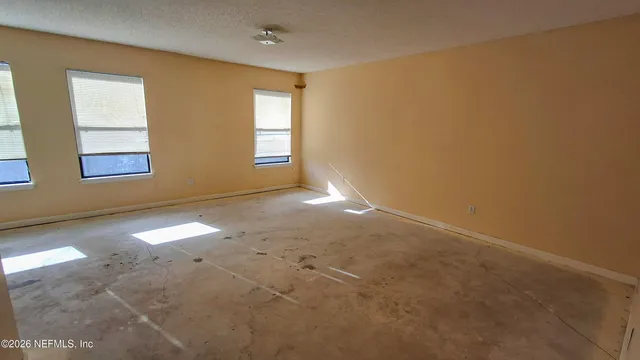 an empty room with windows