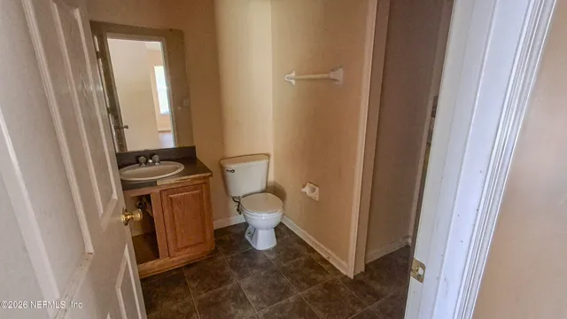 a bathroom with a toilet and a sink