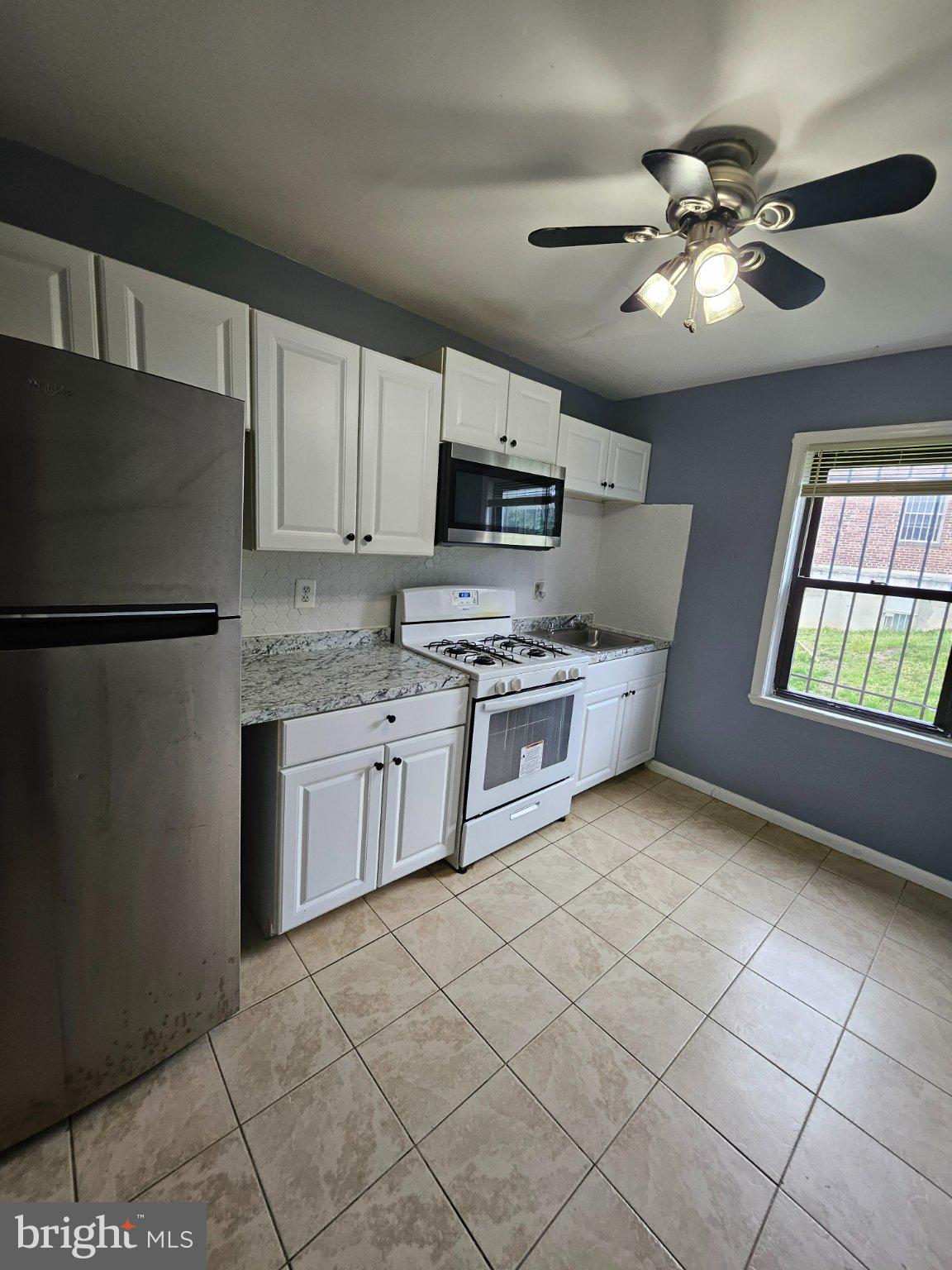 3401 15th Street Southeast, Unit 4 Washington, DC 20032 - Photo 7 of 14 Modern kitchen with sleek finishes.